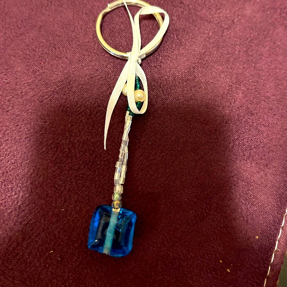 Handmade White beaded  Keychain with white ribbon and blue accent bead